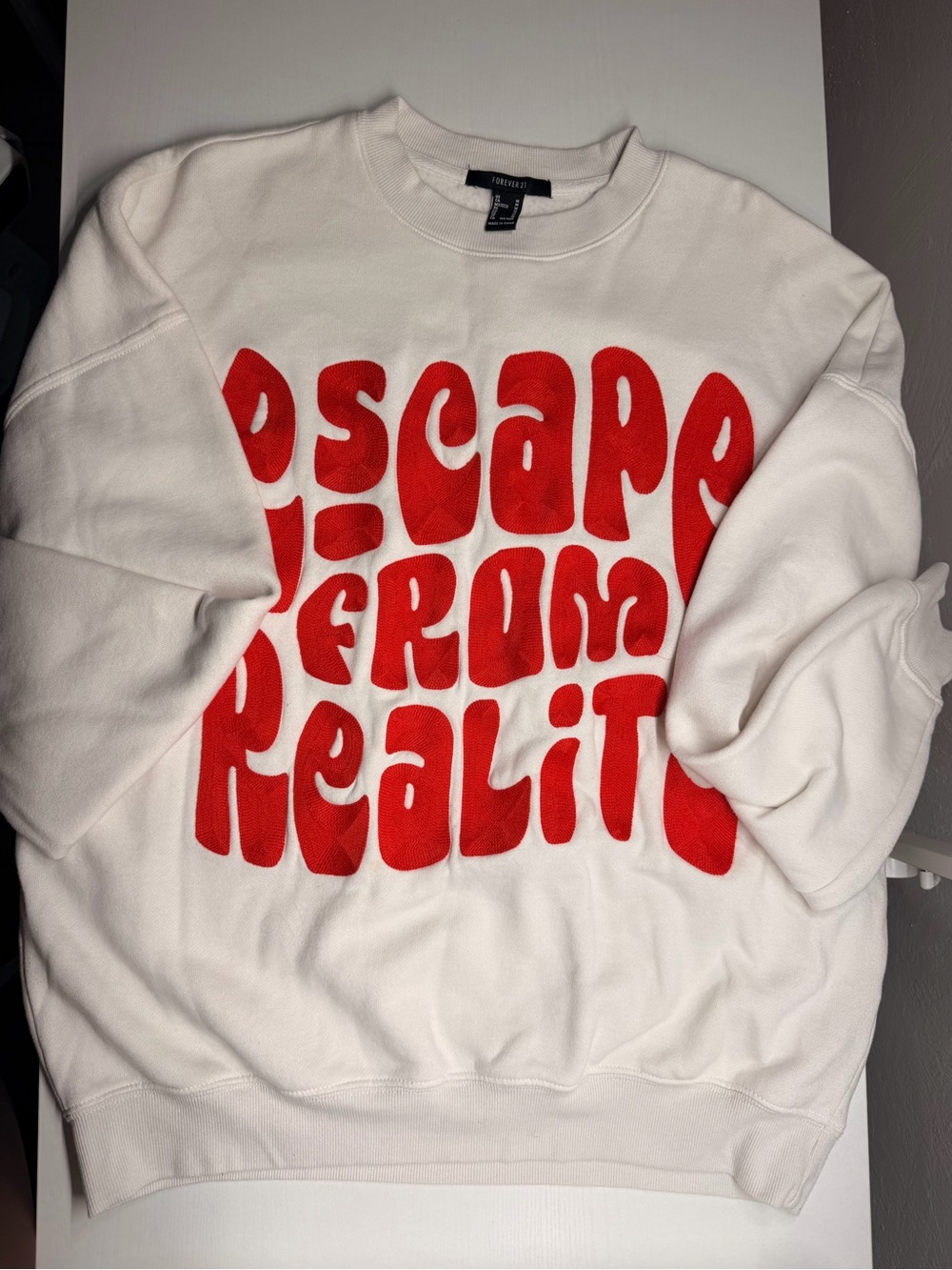 Forever 21 White Crewneck Sweater with Red 'Escape From Reality' Graphic
